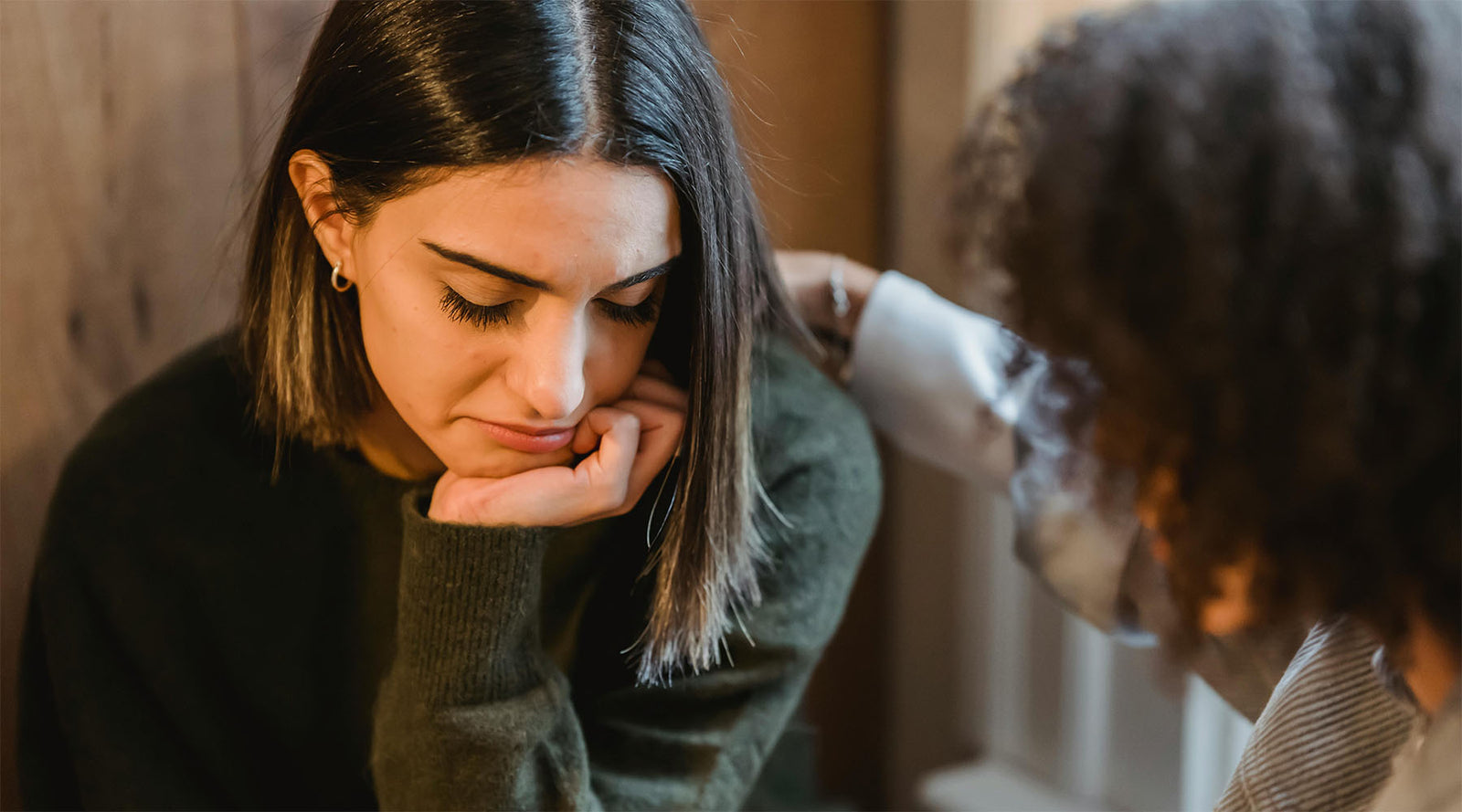 A woman comforting a friend. Condolence Messages: What to Say When Someone Dies