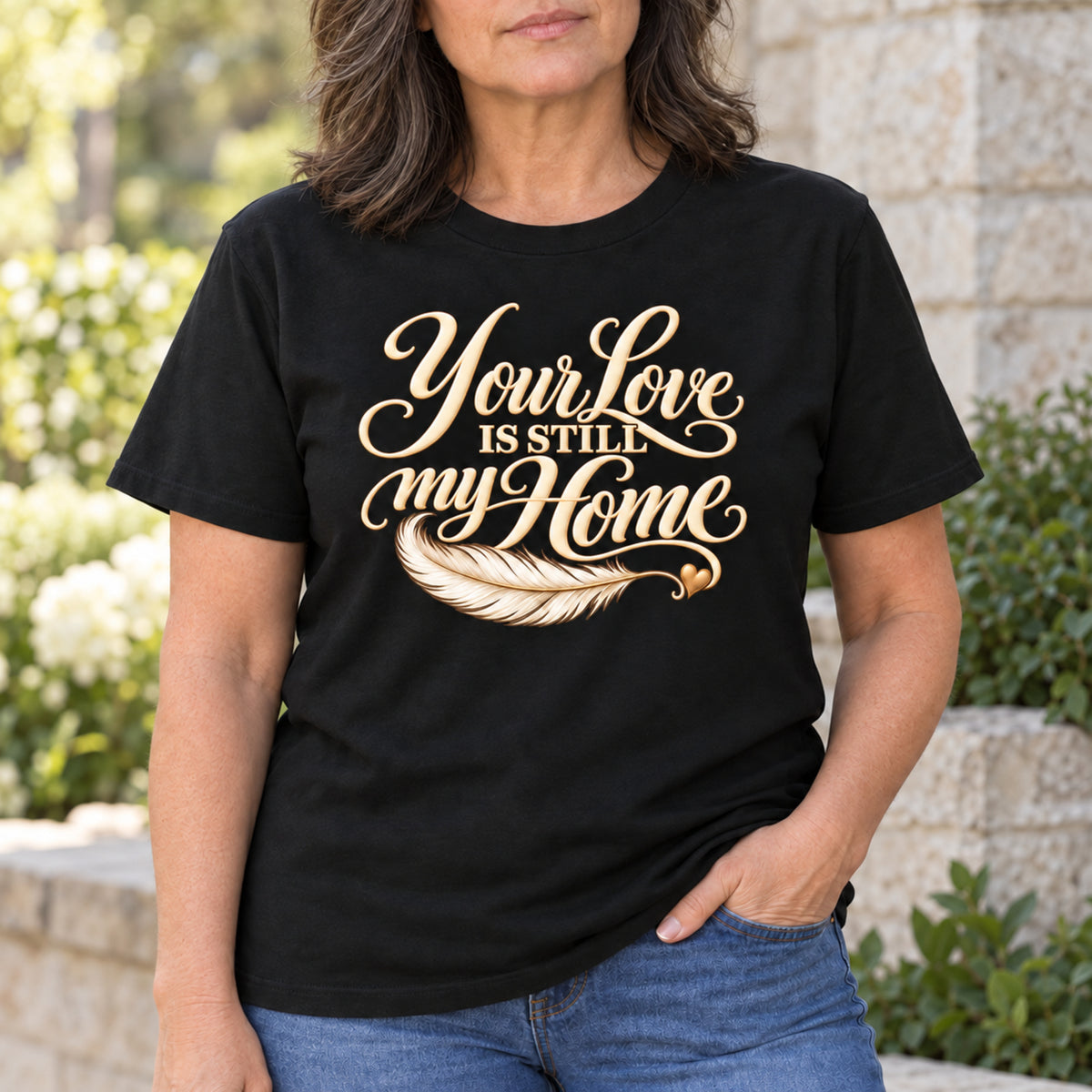 Woman wearing a black Your Love Is Still My Home memorial T-shirt